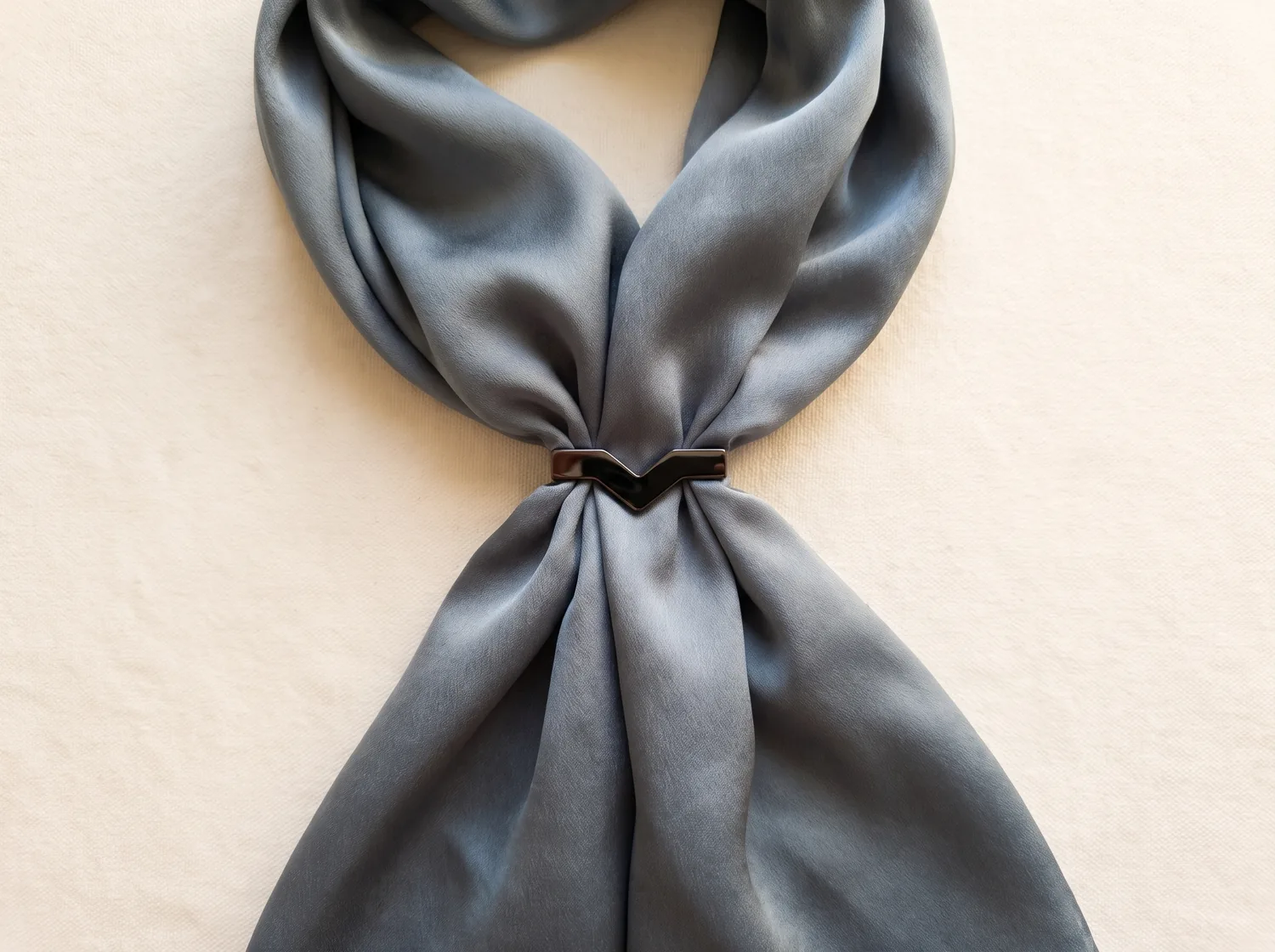 A black StefMag gathering a grey silk scarf.